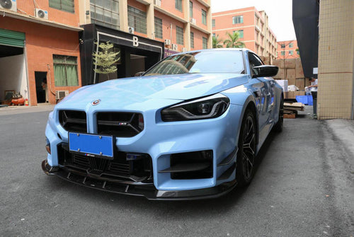 AC Type Bumper Lower Grille in dry carbon fiber for the BMW G87 M2, fitted