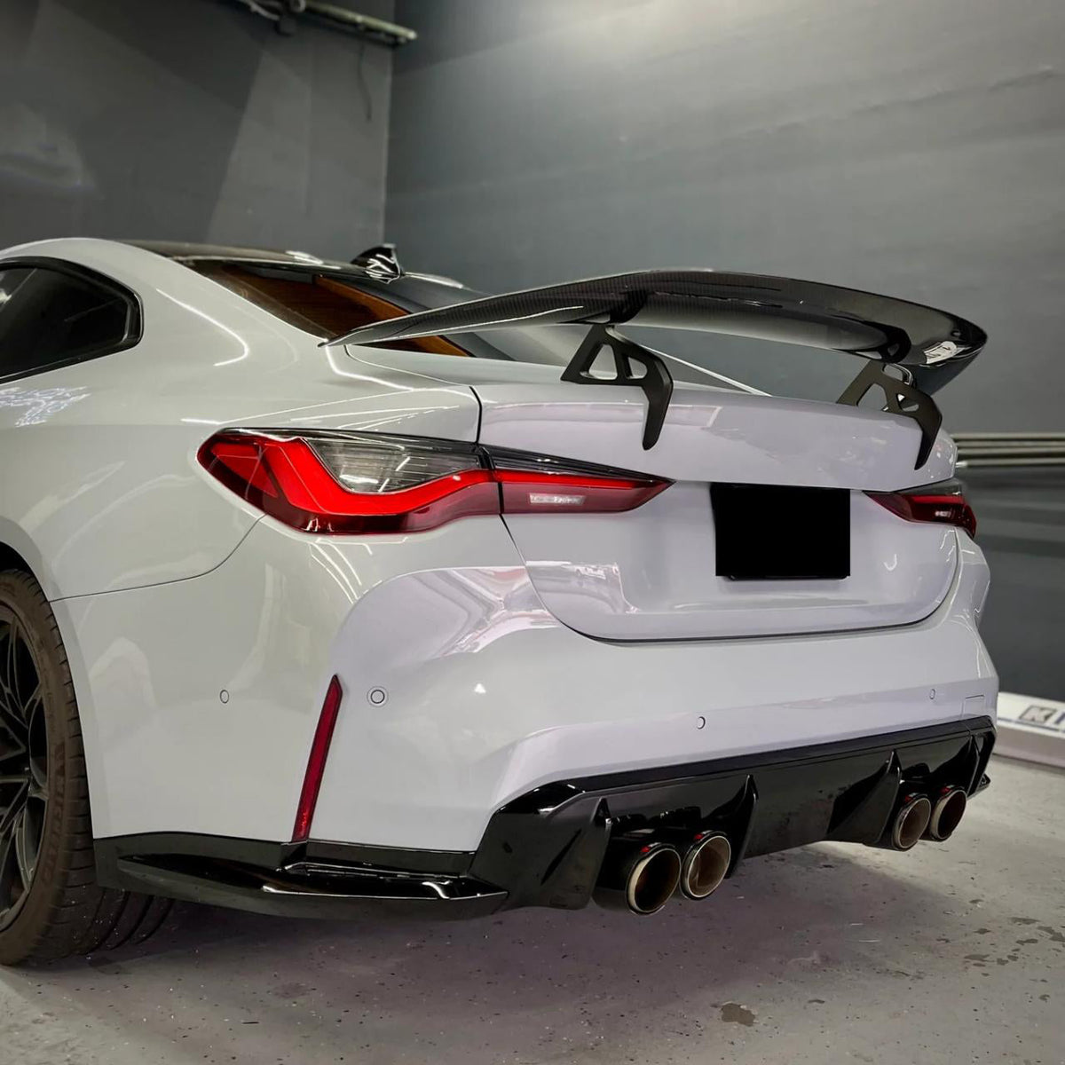 AD-R1 Type Rear Spoiler in dry carbon fiber for the BMW G82 M4, fitted