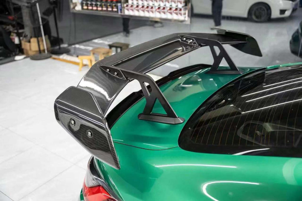 AD-R3 Type Swan Neck Rear Spoiler (With Mounting Base) in dry carbon fiber for the BMW G80 M3 / G82 M4 / G87 M2, fitted