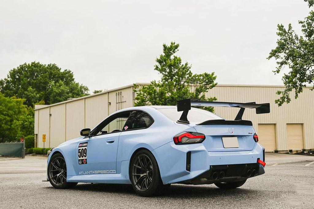 UCW Type Swan Neck Rear Spoiler (With Mounting Base) in dry carbon fiber for the BMW G80 M3 / G82 M4 / G87 M2, fitted