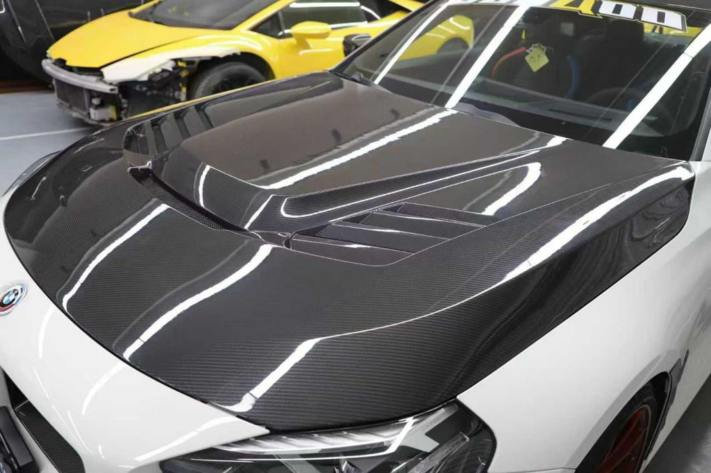 Vor Type Vented Hood in dry carbon fiber for the BMW G87 M2, fitted